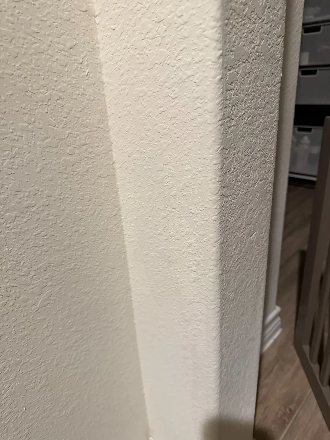 Finished wall texture repair shown from room distance